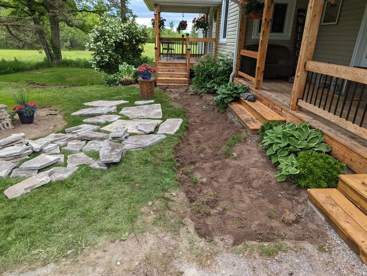 Front porch with stone pathway under construction