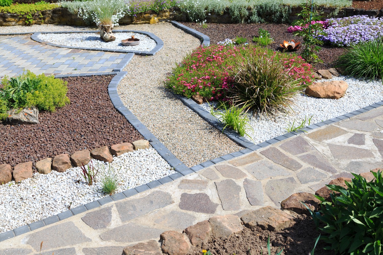 Curved gravel paths in landscaped garden