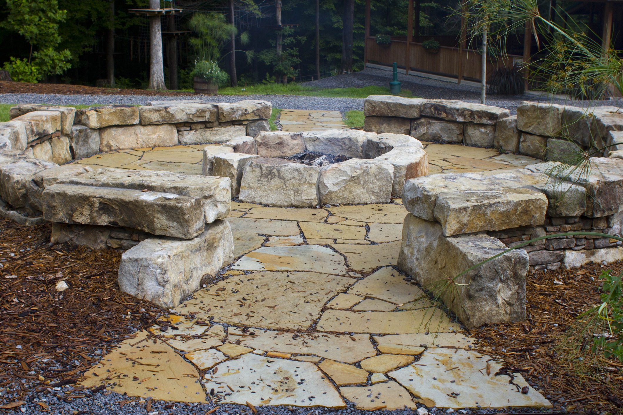 Stone fire pit with circular seating area